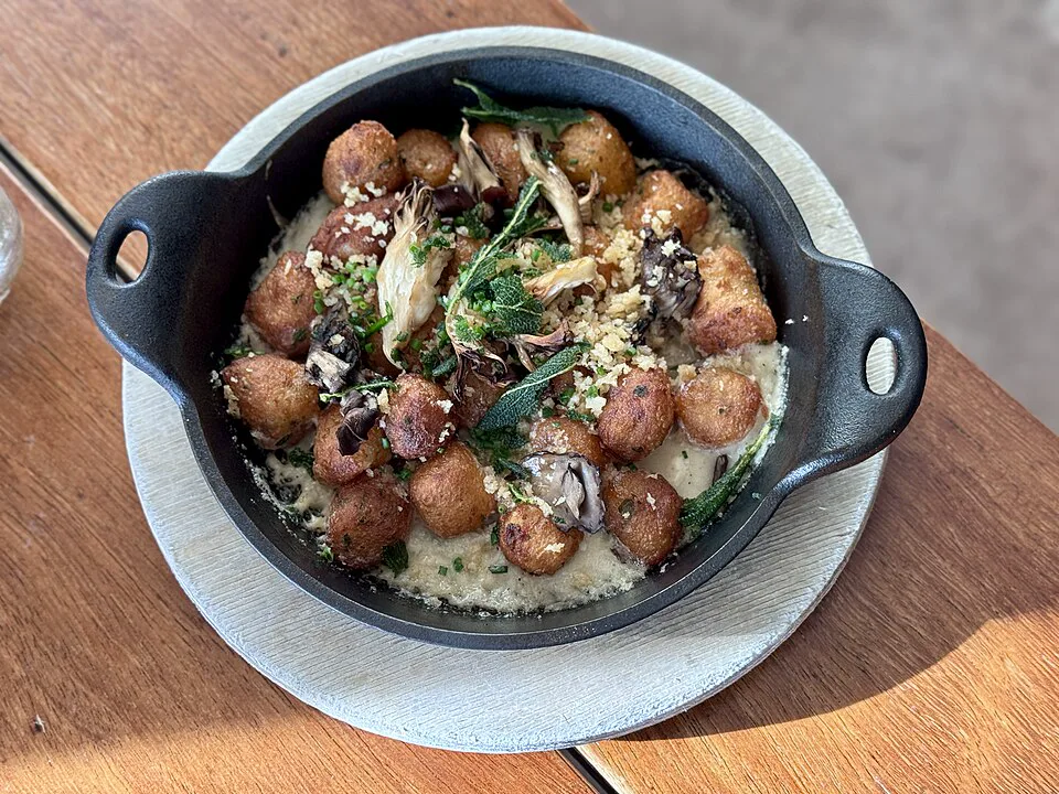 Sautéed Potato Gnocchi with Seasonal Truffles — signature food visual for Arcane